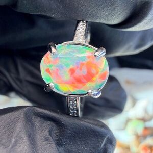 Faceted 1.2 carat Ethiopian opal adjustable ring